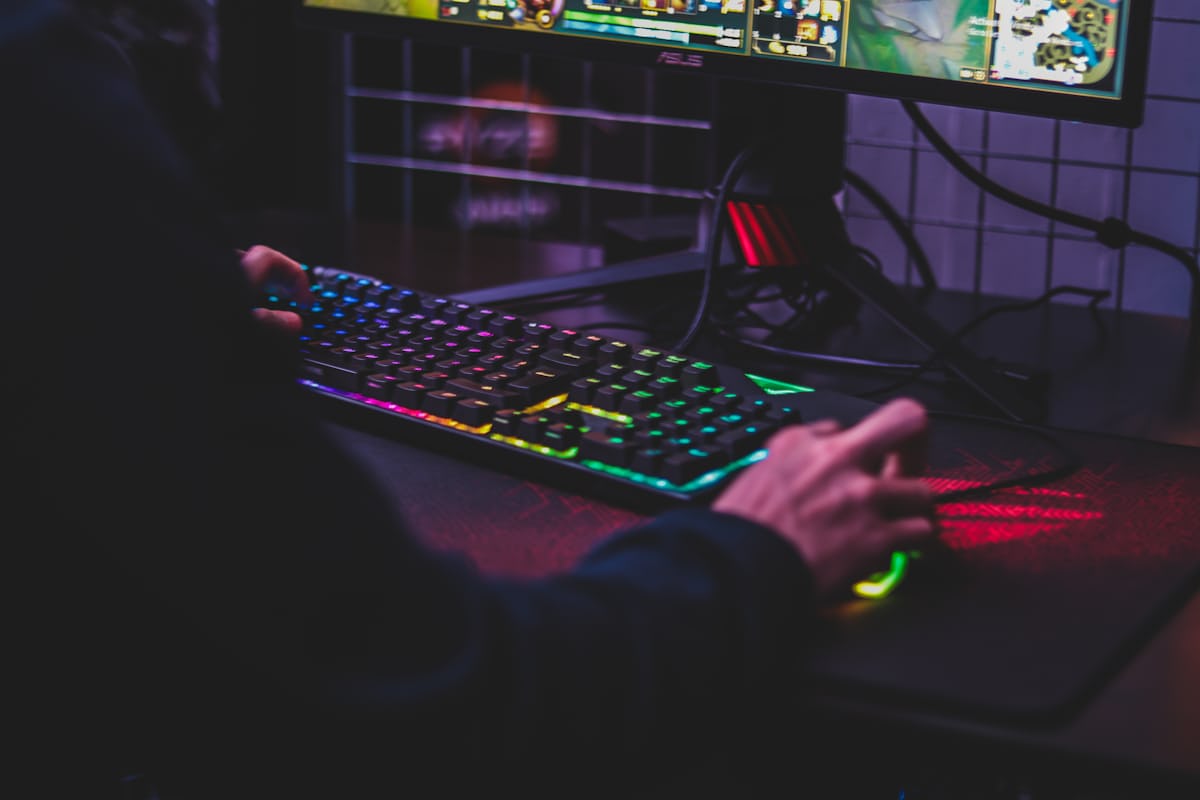 Writer reviewing games at a laptop